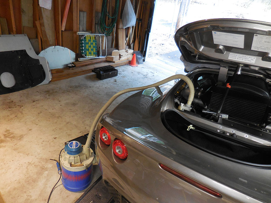 shop vac attached to the coolant reservoir