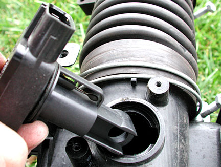 remvoing mass air flow sensor from housing