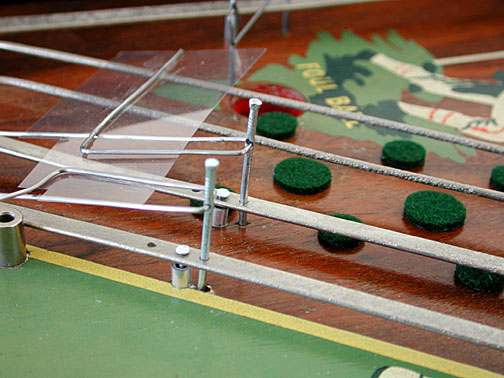 green felt dots to delay the progress of the ball.